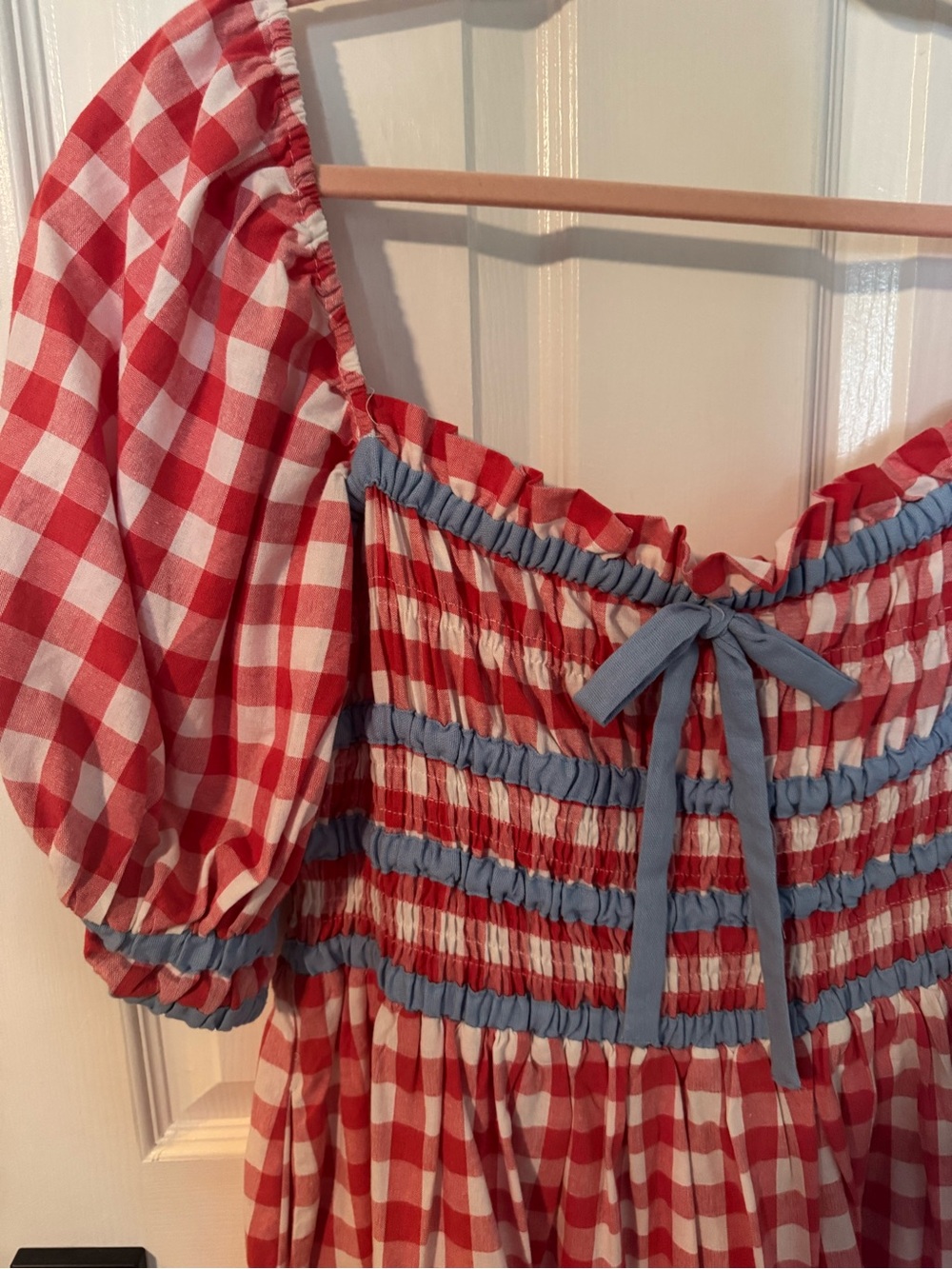 Smocked dress, red gingham with blue piping and bow.